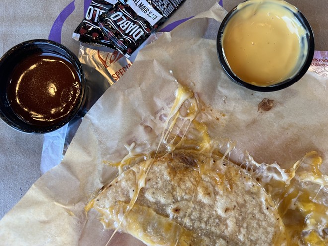 Taco Bell's new Grilled Cheese Dipping Taco is purportedly inspired by birria, but no stew was to be found — only nacho cheese and "savory red sauce." - Nina Rangel