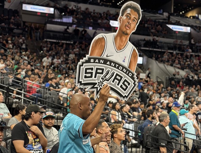 A fan holds up a cutout of No. 1 NBA Draft pick Victor Wembanyama at the Spurs' draft watch party at the AT&T Center. - Michael Karlis