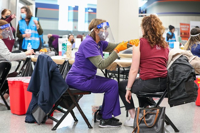 Workers at San Antonio's Alamodome vaccination site administer COVID-19 shots during the height of the pandemic. - City of San Antonio