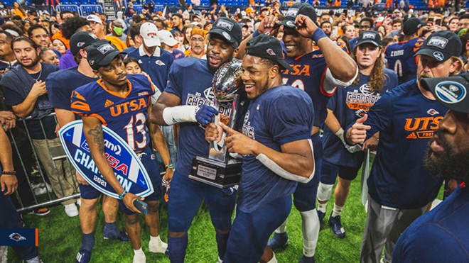 The UTSA Roadrunners hold up the Conference USA Championship trophy after beating North Texas 48-27 at the Alamodome in December. - Twitter / UTSAFTBL