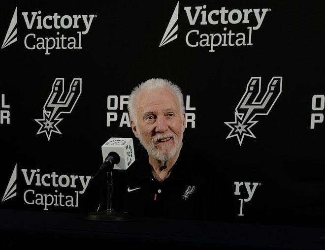 Spurs Coach Gregg Popovich speaks to reporters at the team's media day event on Monday. - Meredith Garcia