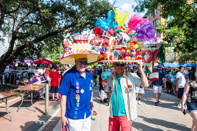 Fiesta goers pose for photos during Fiesta Fiesta, the kickoff for San Antonio's annual citywide party. - Jaime Monzon