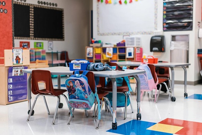 Students' backpacks hang off the back of their chairs in an empty classroom at Blanco Vista Elementary School in San Marcos on Monday August, 23, 2021. - Texas Tribune / Jordan Vonderhaar