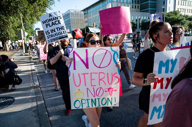 Women march through downtown San Antonio to protest the Supreme Court's decision overturning Roe v. Wade. - Jaime Monzon