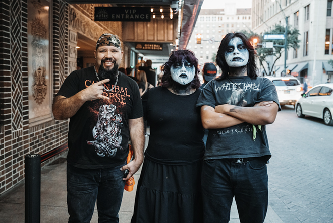 Fans show off their corpse paint and devil horns outside the venue. - Albert Villasana for the Aztec Theatre