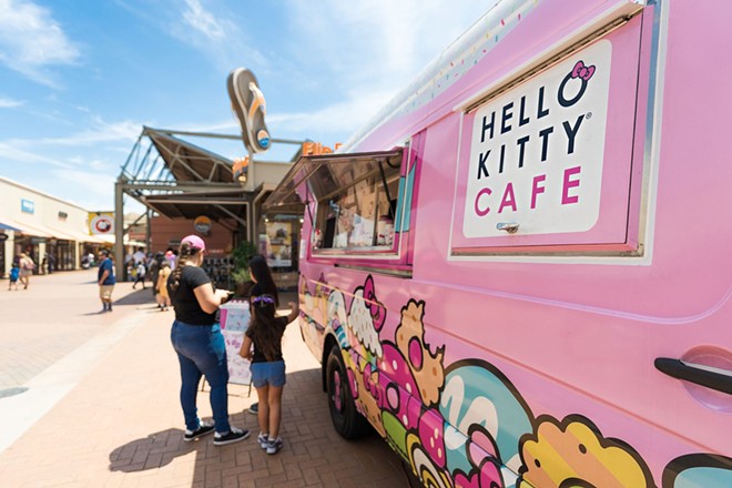 A Hello Kitty Truck parks outside a shopping mall.