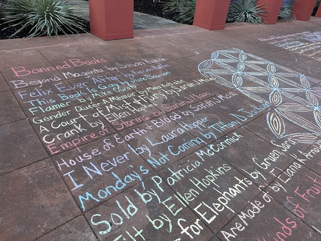 The temporary chalk mural includes a partial list of the books banned in Texas schools over the past few years. - Michael Karlis