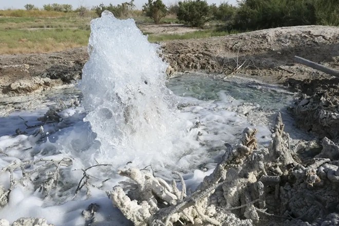 Produced water bubbles up to the surface near Imperial from an abandoned well. Produced water spills and discharges have taken a toll on lands across Texas. - Inside Climate News / Martha Pskowski
