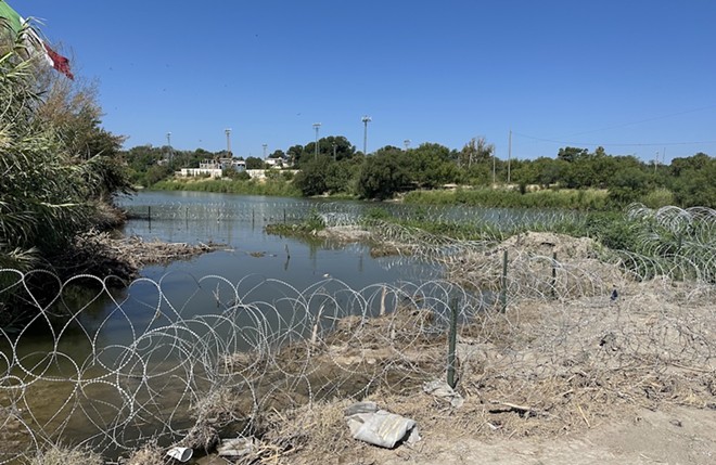 Razor wire deployed under Operation Lone Star is strung along. the Rio Grande River. - Michael Karlis