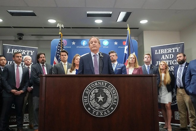 Ken Paxton and his top aides hold a press conference after the House voted to impeach him in May. - Texas Tribune / Bob Daemmrich
