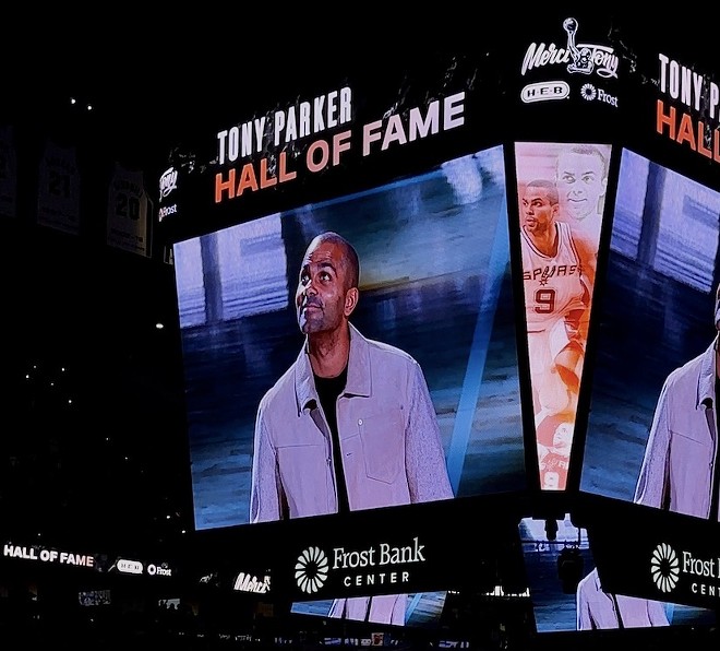 Tony Parker watches as his No. 9 jersey is returned to the rafters of the Frost Bank Center on Sunday. - Meredith Garcia