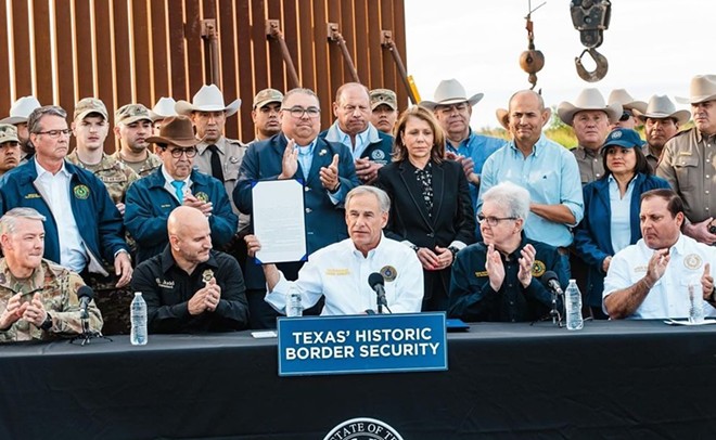 Gov. Greg Abbott shows off his handiwork after signing Texas' latest border security bill. - Instagram / governorabbott