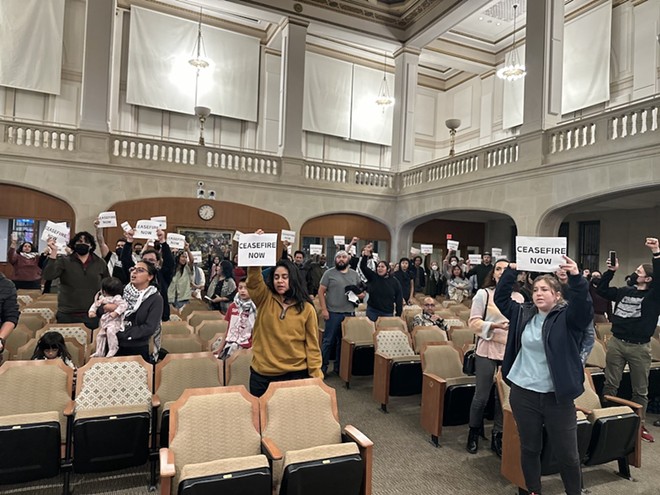 Pro-Palestine protesters hold signs and chant slogans during City Council's public comment session on Wednesday. - Michael Karlis