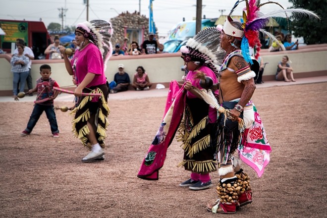 Members of the Ysleta del Sur Pueblo Tribe, a Native American tribe and sovereign nation known as the Tigua, perform a traditional dance at the Ysleta Mission. - Shutterstock / Bill Chizek