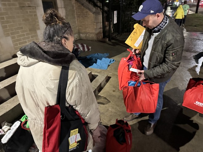 Greg Zlotnick (right) shares a tote bag full of supplies with an unhoused woman he encountered downtown during SA’s latest Point in Time Count. - Stephanie Koithan