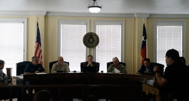 Brett Cross (right) speaks during a Uvalde County Commissioners meeting on Monday. - Screenshot / Youtube