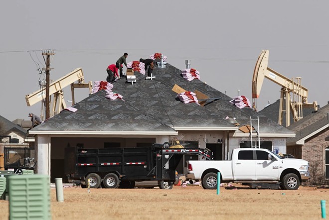 A roofing crew begins to shingle a home under construction in the new Pavilion Park housing development in North Midland on March 14, 2022. Population gains from 2022 to 2023 made Midland the seventh fastest-growing metro area in the country, according to the U.S. Census. - Texas Tribune / Eli Hartman