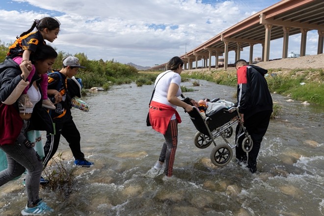 Venezuelan migrants cross the Rio Grande into the United States to seek asylum. - Shutterstock / David Peinado Romero