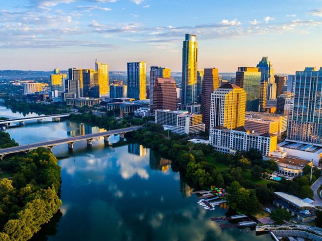 Lady Bird Lake and Lake Austin are connected via the Colorado River, pictured above. - Shutterstock / Roschetzky Photography