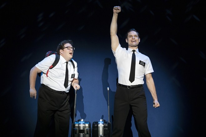 The Book of Mormon follows Elder Kevin Price (Sam McLellan) as he's begrudgingly paired with socially awkward Elder Arnold Cunningham (Sam Nackman) for a mission trip to Uganda. - Julieta Cervantes