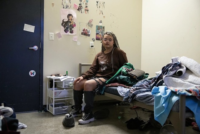 Morningstar, 22, poses for a portrait in her room at Thrive Youth Center in San Antonio. Morningstar realized she was transgender while she was in the state’s troubled foster care system. “I’m not going to hide who I am just to please y’all. I don’t care if I’m in CPS,” she said. Credit: - Texas Tribune / Greta Díaz González Vázquez