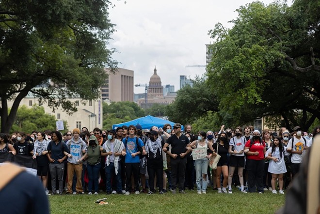 Protesters link arms at the University of Texas at Austin during a pro-Palestine demonstration on April 24, 2024. - Texas Tribune / Julius Shieh