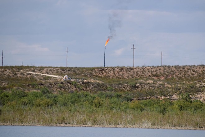 A methane gas flare burns four miles from Red Bluff Reservoir on Feb. 24, 2020. - Inside Climate News / Justin Hamel
