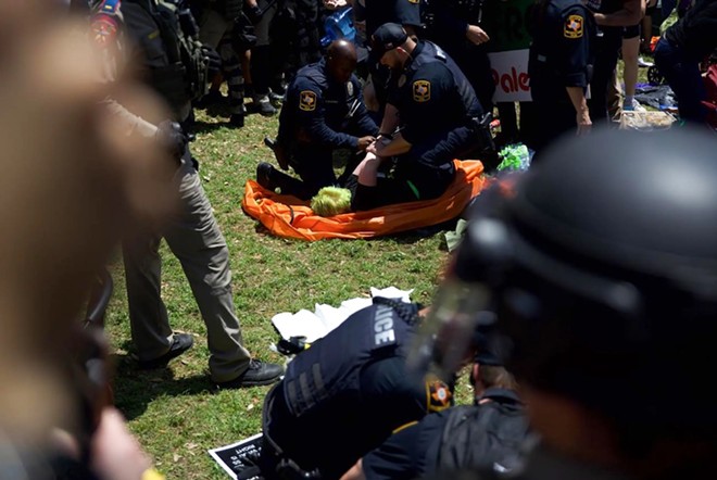 A protester is arrested on the UT-Austin campus on Tuesday, April 29, 2024. - Texas Tribune / Julius Shieh
