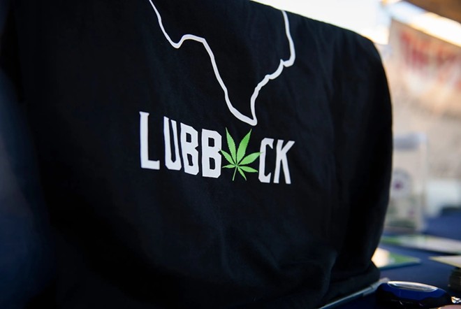 A shirt promotes the legalization of marijuana in Lubbock at the South Plains Fair in Lubbock on Monday, Sept. 25, 2023. - Texas Tribune / Justin Rex