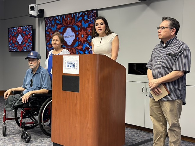 District 7 Councilwoman Marina Alderete Gavito, at podium, is joined by Raymond Najera (right) and Beatrice and Max De Los Santos (left). - Michael Karlis