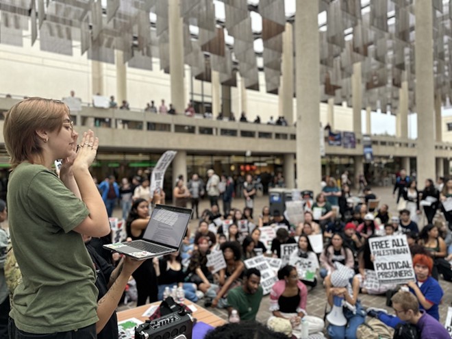 Student activist Kira Stuttr speaks to pro-Palestinian protesters at UTSA this spring. - Michael Karlis