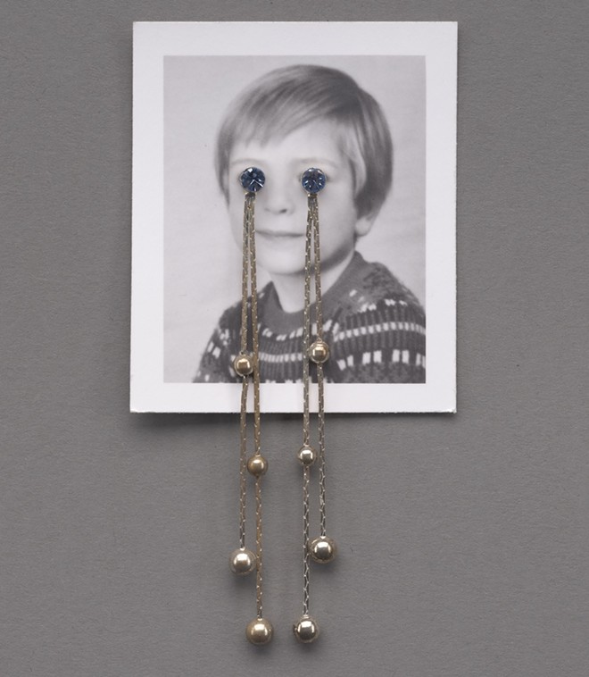 British artist Jonathan Monk's In Edition (to tears) features an eerie passport photo mutilated with a strategically placed pair of dangle earrings. - Linda Pace Foundation Collection, Ruby City