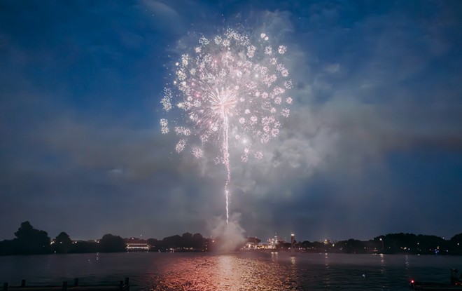 Fireworks light up the sky over Woodlawn Lake during its 2023 Independence Day celebration. - Oscar Moreno