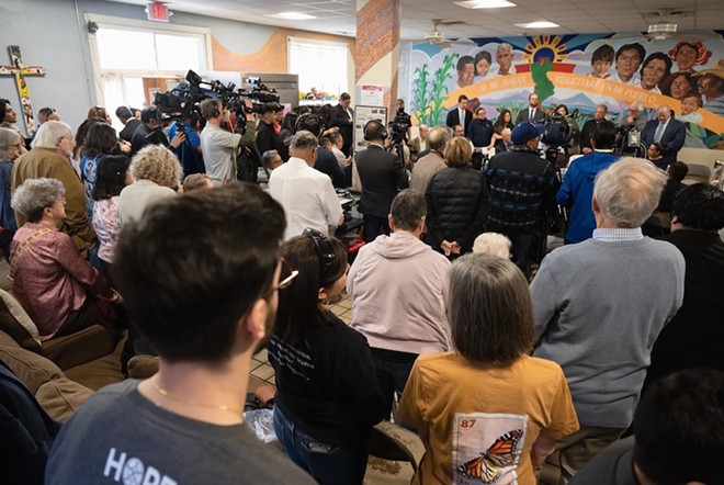 A crowd gathers a press conference at Annunciation House in El Paso on Feb. 23, 2024. Texas Attorney General Ken Paxton sued the migrant shelter, accusing it of operating a stash house and human trafficking. A judge on Tuesday ruled in favor of Annunciation House, which has been providing aid and shelter to migrants in El Paso for decades. - Texas Tribune / Justin Hamel