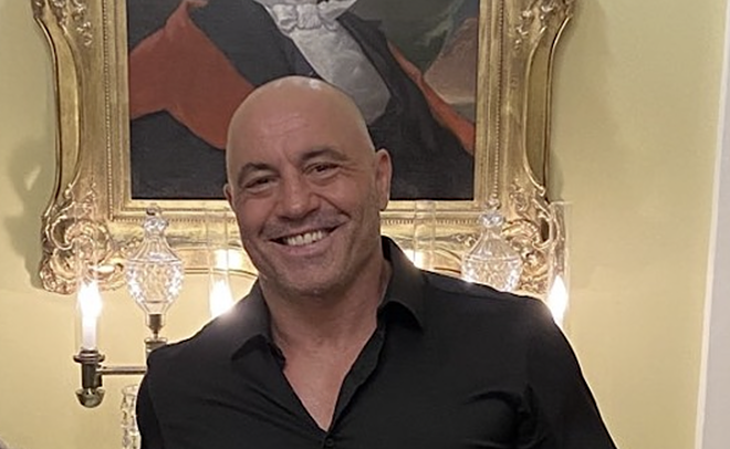 Podcaster and comic Joe Rogan poses in the Texas governor's mansion after his relocation to Austin. - Twitter / GregAbbott_TX