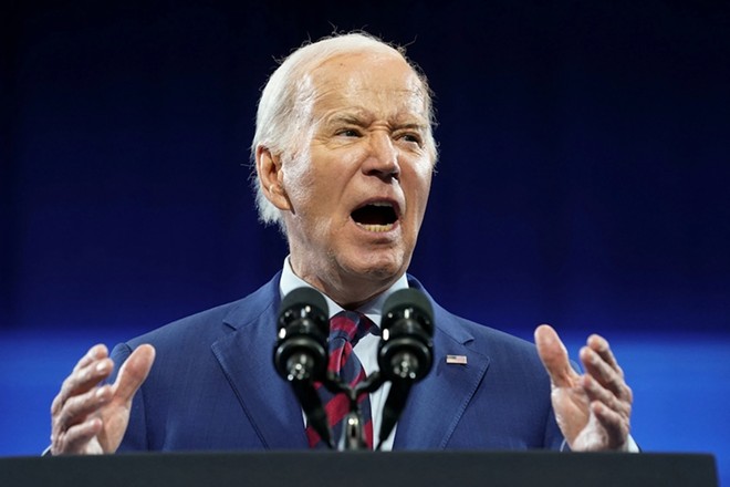 Joe Biden speaks from a podium in June of this year. - Shutterstock / photosince