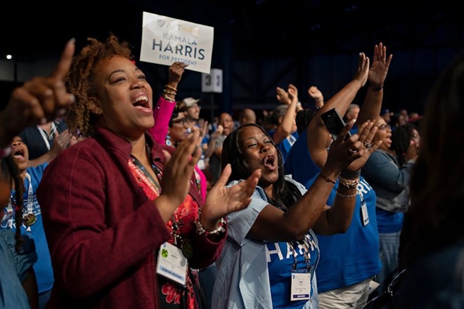 Attendees of the American Federation of Teachers’ 88th national convention clap during Dr. Frederick D. Haynes III's speech, a pastor who spoke before Vice President Kamala Harris' keynote speech at the convention. - Texas Tribune / Danielle Villasana