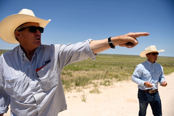 Lynn Cowden, left, and Craig Cowden on their family ranch. During the February Panhandle wildfires, the Cowdens had to transport their cattle to other parts of the country. - Texas Tribune / Annie Rice