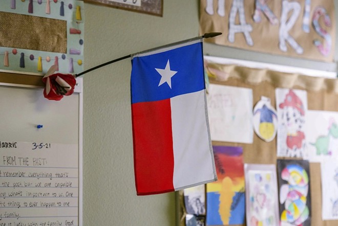 A Texas flag hangs in a Plains Elementary School classroom on Wednesday, Aug. 7, 2024.