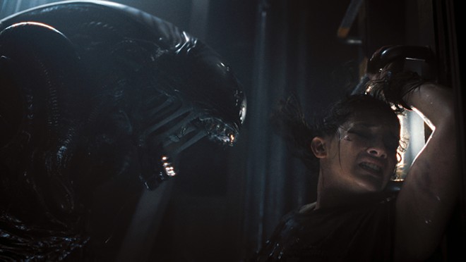 A xenomorphs in Alien: Romulus gets some up-close time with a cast member. - Courtesy Photo / Disney Studios