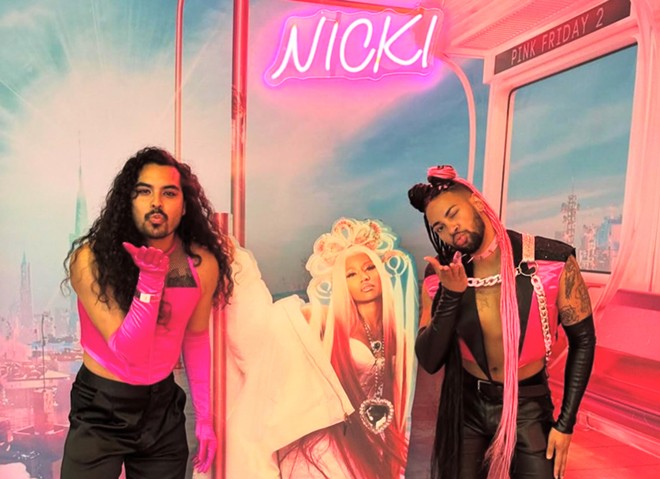 Jalen McKee-Rodriguez (right) poses with husband Nathan McKee-Rodriguez (left) at the Nicki Minaj concert at Austin's Moody Center in May. - Instagram / @theloserteacher