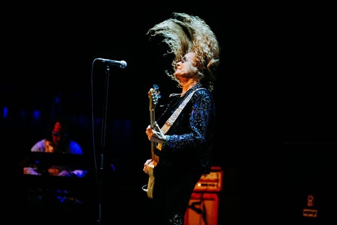 Former Deep Purple member Glenn Hughes shows his rock moves during a 2023 show in San Antonio. - Oscar Moreno