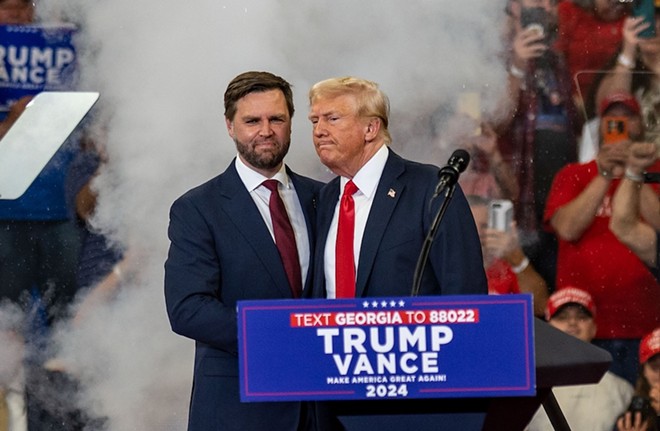 Former President Donald Trump and vice presidential nominee J.D. Vance appear at an Atlanta-area rally, - Shutterstock / Phil Mistry