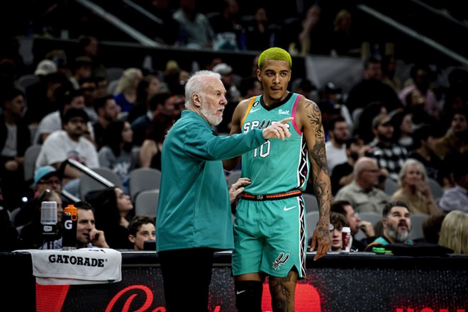 Spurs foward Jeremy Sochan talks to Hall of Fame coach Gregg Popovich before going into a game. - Courtesy Photo / San Antonio Spurs