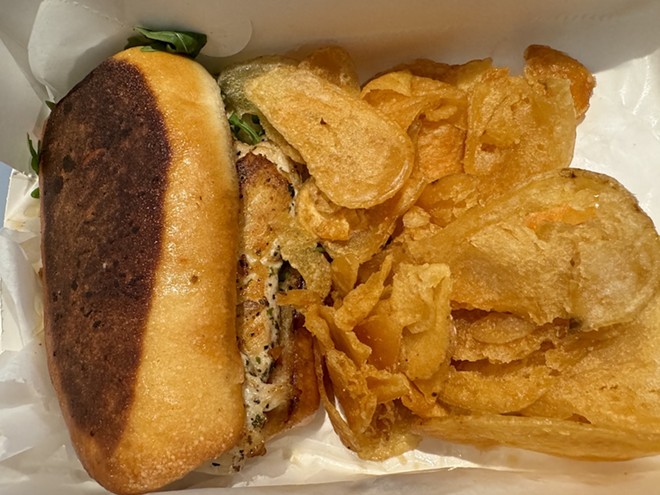 The daily $7.99 lunch special includes half a sandwich, a side salad and freshly fried potato chips. - Stephanie Koithan