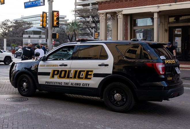 A San Antonio Police Department vehicle parks on a downtown street. - Shutterstock / JHVEPhoto