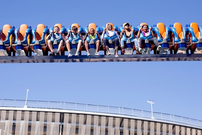 Children enjoy a ride at the State Fair of Texas on Oct. 20, 2016 in Dallas. - Texas Tribune / Allison V. Smith