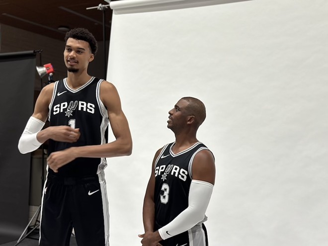 Spurs guard Chris Paul looks up at 7-foot-3 Victor Wembanyama during the team's media day. - Michael Karlis