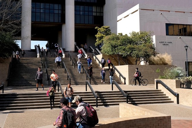 Students walk nearby the Albert B. Allen Library on Texas State University in San Marcos on Jan. 31, 2018. - Texas Tribune / Laura Skelding