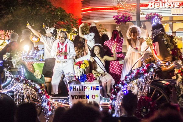 Light Up Your Saturday Night with the Illuminated Fiesta Flambeau Parade